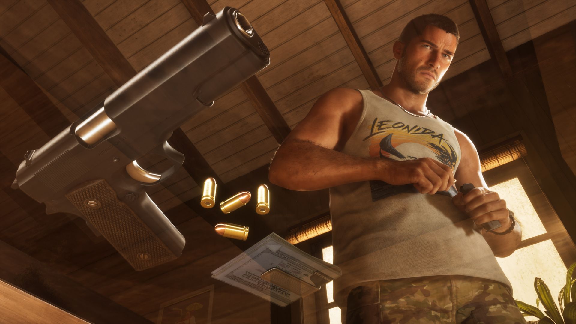 A large semi-automatic pistol and loose rounds lie on a table while Jason loads a magazine behind them