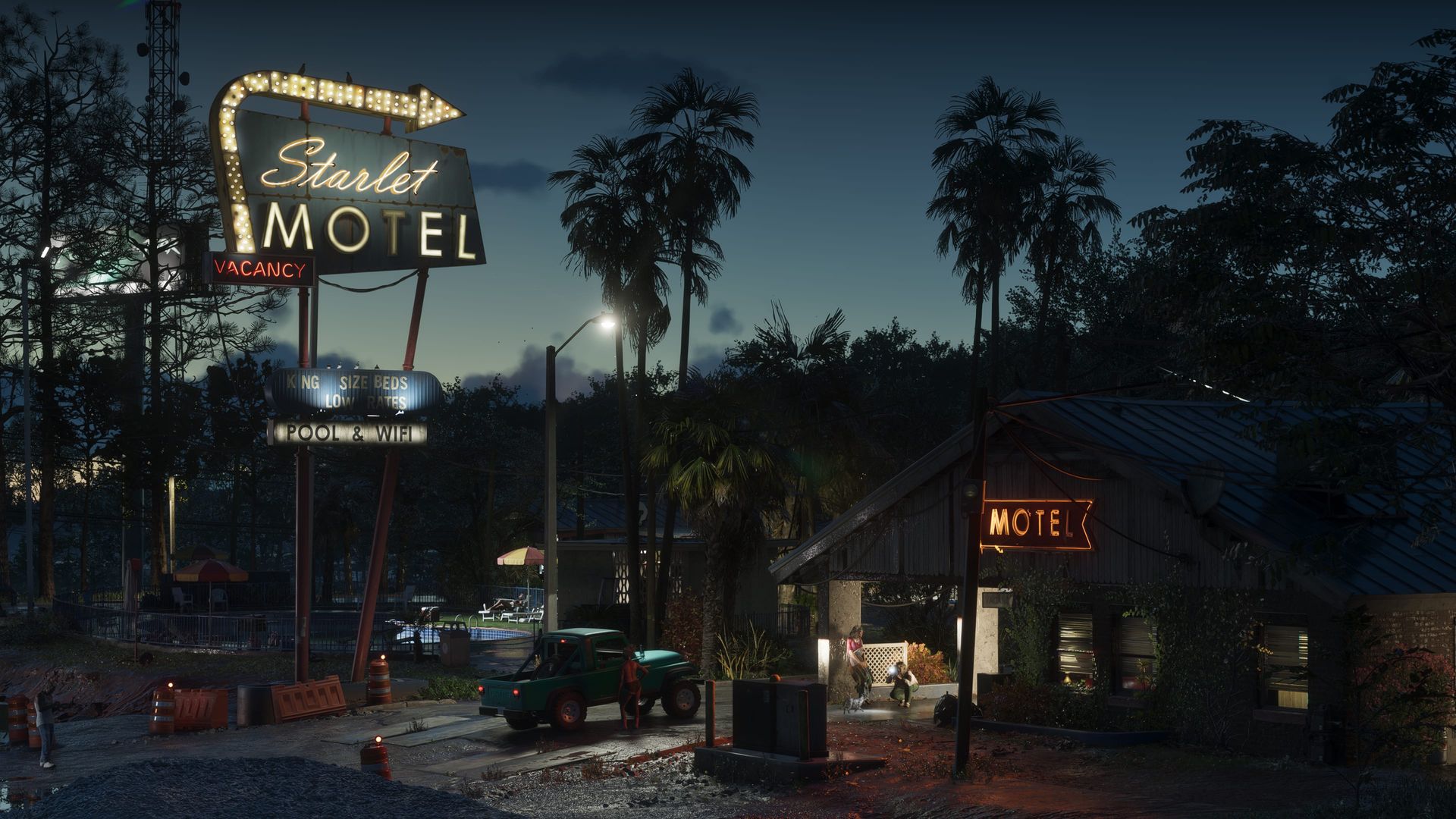Ein Motel an der Landstraße mit leuchtendem Neonschild bei Nacht